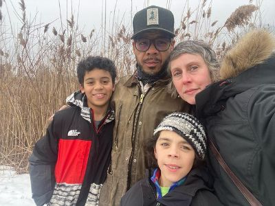 Nadia Farmiga, Wilson Costa, Tadeo Costa, and the other son are all out in the snow wearing woolen clothes.
